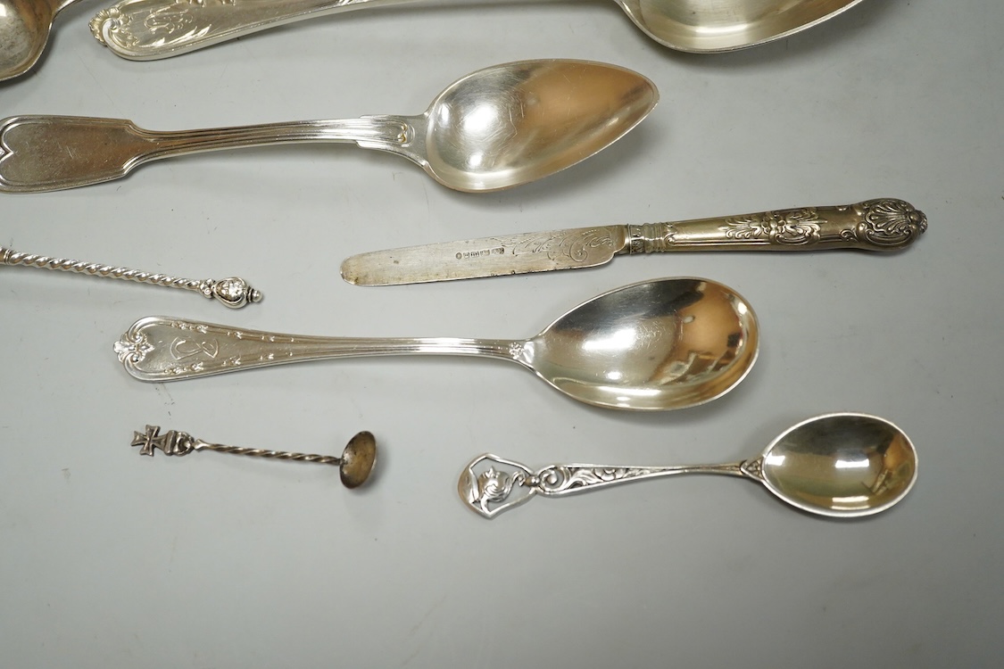 A George III silver Old English pattern dessert spoon, London, 1807, a later silver teaspoon and ten other items of white metal cutlery including a soup ladle, German tablespoon, pair of sugar tongs etc.